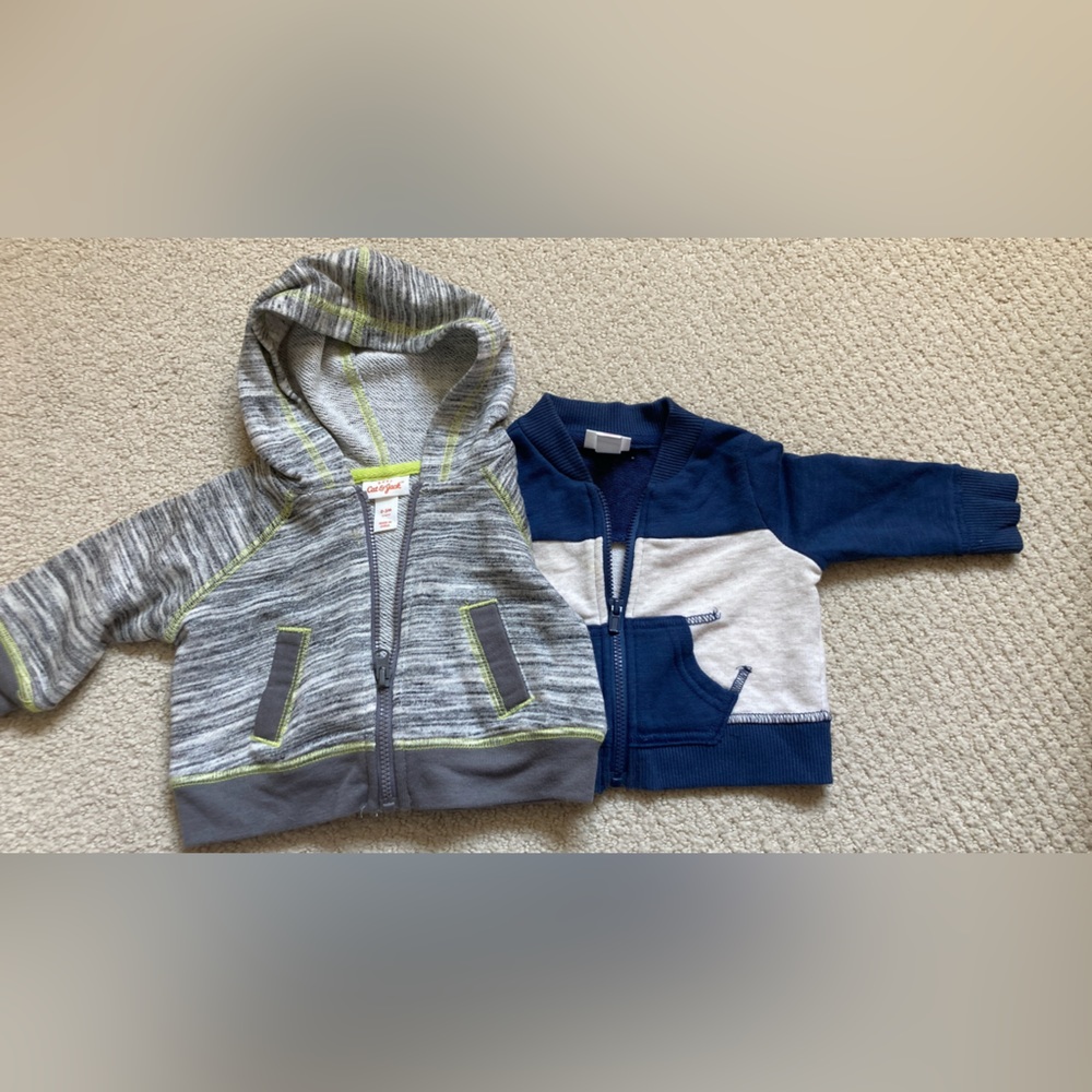 Two Cat & Jack zip up sweaters 0-3 month size.